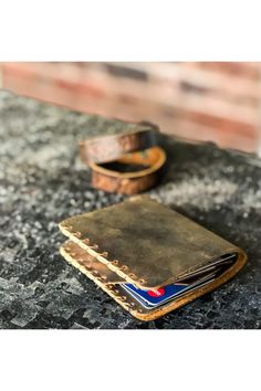 Handmade Leather Wallet, Fathers day Gift, %100 Handmade Wallet for men This bifold leather will keep your cards and cashes in safe in style. -Size:3,35''x 3.95'' (8,5x10cm) -%100 Cow Leather -Handmade -Minimalist Design -You can keep 5-8 cards and a lot of cashes That can be great gift for your dad or boyfriend. We will be glad to prepare gift box for you :) If you need a gift box please send a message with your order. Lykiart is always aiming to make your life eaisier while keeping your style high. We don't offer you only couple of products, we offer you to complete deficient part of your style with us.  We will always be here to solve any difficulty that you had. Please do not hesitate to contact with us any time in a day (7/24) If you follow our shop on Etsy, we will always be glad to Vintage Trifold Wallet With Coin Pocket, Everyday Vintage Wallet With Rfid Blocking, Vintage Leather Trifold Wallet For Everyday, Gift Bi-fold Card Holder With Waxed Finish, Rustic Leather Wallets With Card Slots, Vintage Leather Card Holder For Everyday Use, Rustic Leather Wallets, Vintage Handmade Trifold Wallet For Everyday, Vintage Bifold Wallets With Card Slots