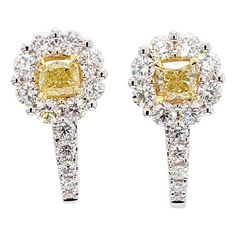 RareGemWorld's classic natural cushion cut yellow diamond earrings. Mounted in a beautiful 18K Yellow and White Gold setting with natural cushion cut yellow diamonds. The yellow diamonds are surrounded by round natural white diamond melee. These earrings are guaranteed to impress and enhance your personal collection! Total Weight: 1.65cts Length x Width: 18.1 x 8.8 mm Center Diamond Measurements: 3.1 - 3.7 x 3.5 - 4.0 mm Natural Cushion Yellow Diamonds Natural Round White Diamonds 18k Yellow/White Gold All diamonds are guaranteed natural International Shipments: Please note that customers are responsible for all import duties and taxes applicable to the country of shipment Returns: Returns accepted in original format within 14 days of receipt Do not forget to view our entire inventory! Tha Yellow Diamond Earrings, Classic Diamond Earrings, Earring Video, Yellow Diamond Earring, Yellow Cushion, Yellow Diamonds, Gold Cushions, Natural Cushions, White Gold Set