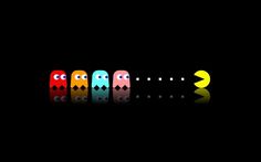 pac - man wallpapers are lined up in the dark