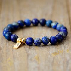 The Handmade Natural Lapis Lazuli Beaded Bracelet with a Gold Plated Tag looks great. It will make the perfect gift 🎁 for someone special, or treat yourself as you deserve it 💖 🥰 These Bracelets have been made using high quality Natural Lapis Lazuli and have a Gold Plated Tag with MC for MantraChakra. They are available as 4mm, 6mm and 8mm. Lapis Lazuli brings out your inner priestess, heightens inner-vison and deepens wisdom. It benefits the Throat Chakra with communication and expression of Adjustable Lapis Lazuli Stretch Bracelet With Round Beads, Adjustable Lapis Lazuli Bracelet With Round Beads, Lapis Lazuli Beaded Bracelets With Gemstone, Lapis Lazuli Gemstone Beaded Bracelets, Spiritual Lapis Lazuli Round Beads Bracelets, Gift Lapis Lazuli Beaded Bracelets With Polished Beads, Adjustable Lapis Lazuli Bracelet With 8mm Beads, Lapis Lazuli Beaded Bracelet Gift, Lapis Lazuli Gemstone Beads Bracelet For Gift