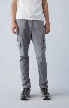 Casual meets cool with the new Eco Stretch Gray Slim Cargo Pants from PacSun. This go-to pair is designed with an elastic stretch waistline, adjustable drawstrings, side pockets, zip cargo pockets, a drawcord hem, and a slim fit.

Learn more about PacSun eco items Stretch Cargo Pants With Cargo Pockets For Outdoor, Outdoor Stretch Cargo Pants With Side Pockets, Relaxed Fit Cargo Pants With Functional Drawstring, Gray Relaxed Fit Cargo Pants With Elastic Waistband, Casual Gray Cargo Pants With Elastic Waistband, Functional Outdoor Bottoms With Drawstring, Functional Cargo Pants For Travel, Utility Bottoms With Pockets For Travel, Utility Travel Pants With Side Pockets