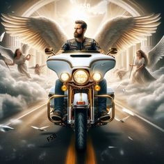 a man riding on the back of a motorcycle down a road with angel wings above