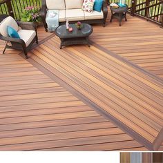 an outdoor deck with furniture and flowers on it