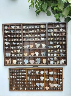 two wooden boxes filled with heart shaped rocks