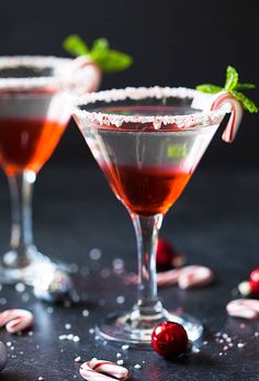 two martinis with candy canes and peppermint garnish