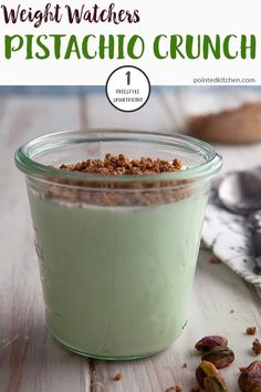 a glass jar filled with pistachio crunch pudding