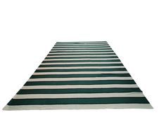 a green and white striped rug on a white background with room for text or image