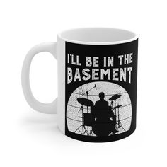 a coffee mug that says i'll be in the basement