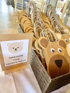 there are some brown paper bags in the shape of bears and bear heads on display