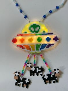 an image of a beaded toy that is hanging on the wall