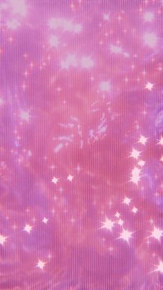 a pink and purple background with white stars