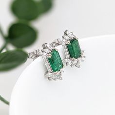 These beautiful stud earrings feature a pair of 2.58 carat weight Emerald gemstones with natural earth mined diamonds set in solid 14K gold. These Emerald studs make a lovely May birthstone gift for your loved ones! These earrings are made with solid 14k Gold and natural earth mined SI / G-H Diamonds. As listed, these earrings are ready to ship. If you're interested in purchasing this setting with a different center stone please message us! Fine Jewelry Gemstone Baguette Cut Earrings, Fine Jewelry Baguette Cut Gemstone Earrings, Anniversary Baguette Cut Gemstone Earrings, Emerald Cut Diamond Earrings With Gemstone, Emerald Cut Stud Earrings, Emerald Studs, Emerald Stud Earrings, Designer Silver Jewellery, Beautiful Stud Earrings