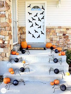 halloween decorations on the front steps of a house