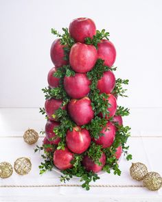 an arrangement of red apples on top of each other