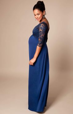 Make an entrance with our Lucia Maternity Gown in stunning Imperial Blue. Designed to fit and flatter at every stage of pregnancy, there’s elegant gathering under the bust to define your waist and a luxurious floor-length skirt with a subtle sheen to skim over your curves. Featuring a sheer lace bodice with mid-length sleeves and a sultry v-shaped back for added drama, you’ll turn heads at every special occasion. Sheer lace neckline V-Shaped Back ¾ length sleeves Jersey skirt with a subtle sheen Blue Maxi Maternity Dress For Party, Blue Maxi Length Maternity Dress For Wedding, Blue Maxi Length Maternity Dress, Blue Maxi Maternity Dress For Wedding, Elegant Blue Maternity Gown, Blue Maternity Maxi Dress, Blue Floor-length Maternity Dress, Elegant Blue Maxi Maternity Dress, Fitted Blue Maxi Length Maternity Dress