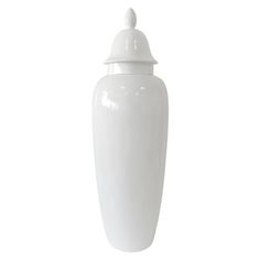 a large white vase with a lid on the top is shown in front of a white background