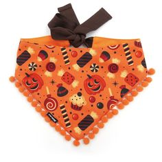 an orange dog bandana with candy and candies on it