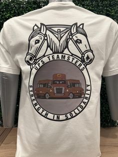 Show support for our Union members with our exclusive Delivery Trucks & Teamster Logo T-Shirt. This unique design features detailed illustrations of iconic Big Brown trucks alongside the proud Teamster logo - symbolizing unity, hard work, and solidarity. Key Features: -Premium Quality Fabric: Made from 100% combed and ring-spun cotton, this t-shirt offers exceptional softness and durability. Perfect for everyday wear, it ensures comfort and longevity. -Expert Craftsmanship: Each t-shirt is meticulously crafted with attention to detail, from the precise stitching to the vibrant, long-lasting print. Our commitment to quality means you get a product that stands the test of time. -Unique Design: The detailed depiction of UPS trucks and the Teamster logo is printed using eco-friendly inks, ensu Delivery Trucks, Parcel Service, Logo T Shirt, Off Duty, Hard Work, Tshirt Logo, Design Features, Quality Fabric, Favorite Outfit