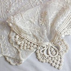 an image of some white lace on a bed