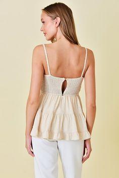 The Renata Crochet top is the perfect summer addition to your wardrobe. With its crochet bustier style and babydoll silhouette, it exudes both elegance and playfulness. Its neutral color allows for versatile styling, making it suitable for both casual and dressy occasions. Elevate your fashion game with this must-have piece. True to size model is wearing size small Crochet Bustier, Stretch Crochet Top With Lace Trim, Sleeveless, Top Dress, Neutral Color, New Arrival Dress, Matching Sets, Perfect Summer, Neutral Colors, Fashion Games