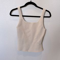 Aritzia Sculpt Knit Crop Tank. Size Medium. Color Is Matte Pearl. Brand New. Never Worn. Beige Seamless Knit Top, Seamless Beige Knit Top, Fitted Cream Knit Tank Top, Aritzia Sculpt Knit, Trip Fits, Candle Pedestal, Cropped Blazer, Summer Fits, Knit Crop Top