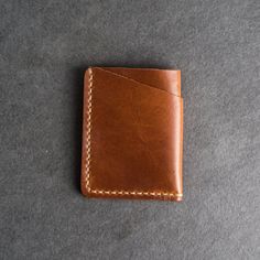 This is the best wallet you’ll ever own. The Card Holder Wallet will hold your essentials while looking great. The leather will gain a beautiful, unique patina over time as you put your wallet to good use. SPECS Wallet Size: 3.75" x 3" Wallet Thickness: .375" Leather Color Options: Choose from Whiskey, Café, Espresso, Black, Green, Red, or Plum Personalization Character Ranges: Choose the range you need from No personalization, 1-3 Initials, or 4-9 Characters Holds 6 cards plus some folded cash Leather Card Holder Wallet, Personalized Leather Wallet, Times New Roman, Best Wallet, Minimalist Wallet, Type Setting, Card Holder Wallet, Small Wallet, Card Holder Leather