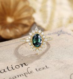 Oval Blue Green Sapphire Engagement Ring, Vintage Teal Sapphire Ring, Halo Moissanite Ring, Half Eternity Moissanite Band Ring#:NC1118 Center stone: Teal sapphire(Blue Green Sapphire) oval cut 5*7mm side stones: moissanite or diamond size/weight:0.55ct,1.5*3mm marquise/round Custom orders are most welcome! Please feel free to ask for any item, any adjustments or anything else you want me to make. Rush order Orders can be expedited for a fee. If your order needs to be expedited, please contact us Teal Sapphire Engagement Rings, Moissanite Sapphire Ring With Halo Setting For Anniversary, Sapphire Moissanite Ring With Halo Setting For Anniversary, Green Sapphire Rings With Halo Setting, Sapphire Moissanite Diamond Ring With Halo Setting, Heirloom Emerald Ring With Moissanite Center Stone, Green Sapphire Jewelry With Halo Setting, Elegant Sapphire Moissanite Ring For Proposal, Heirloom Moissanite Emerald Ring With Center Stone