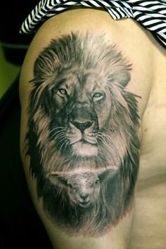 a man with a lion tattoo on his arm