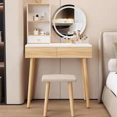 a bedroom with a vanity, mirror and stool