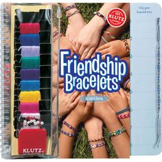 a book with bracelets on it and two hands holding each other in the middle