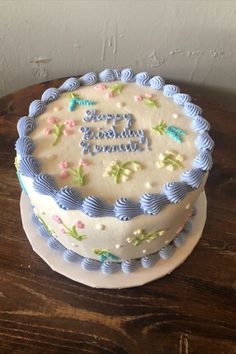 a birthday cake sitting on top of a wooden table