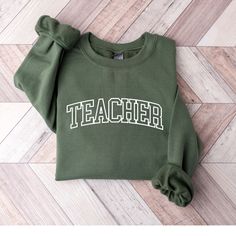 Teacher Sweatshirt, Teach Sweatshirt, Teacher Shirt, Cute Shirt for Teachers, Teacher Gifts, Elementary School Teacher Shirt, Teacher Shirt ♥ PRODUCTION TIME: 1-5 days (Usually 2-3 days) ♥ SHIPPING TIME: 2-5 days (Usually 3 days) ♥ PRODUCT DESCRIPTION: Gildan 18000 Sweatshirt adult UNISEX sizing , not a Women's size! 50% cotton, 50% polyester (fibre content may vary for different colors) Midweight 8.0 oz 1x1 ribbed collar, cuffs and waistband with spandex - For Shirt Sizes please refer to the Listing Image. ♥ CARE INSTRUCTION: Machine wash: warm (max 40C or 105F); Non-chlorine: bleach as needed; Tumble dry: low heat; Iron, steam or dry: medium heat; Do not dryclean ♥ PRINTING METHOD: DTG printing method is used for these shirts. A process of printing on textiles and garments using speciali Teach Sweatshirt, Teacher Crewneck, Pe Teacher Gifts, Teacher Sweater, Mrs Sweatshirt, New Teacher Gifts, School Sweatshirts, Teacher Team, Teacher Sweatshirt