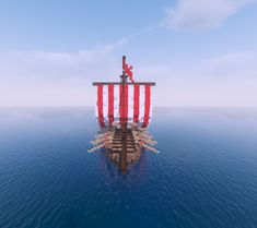 a large red and white ship floating in the ocean