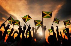 a group of people holding flags in the air