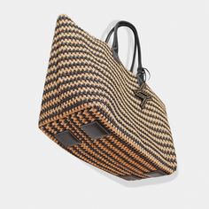 The ultimate in beachside luxury with the Bianca Tote, crafted for your stylish escapes to Capri, st. Tropez, and other exciting destinations.Be the trendsetter with this must-have tote. Raphia crochet Nappa soft calfskin Top handle, 9.5'' (24,1 cm) drop Height: 13'' (33cm) Width: 17,7'' (45cm) Depth: 9,8'' (25cm) Gold hardware Detachable raphia crochet & leather pouch (Height: 8'' (20cm) Width: 10.7'' (27cm)) Canvas lining 100% Made in Italy. Cleaning and Care Our handbags are made of the highe Chic Woven Leather Top Handle Beach Bag, Beach Crochet Bag With Intrecciato Weave And Top Handle, Woven Leather Top Handle Beach Bag, Vacation Top Handle Woven Crochet Bag, Vacation Shoulder Bag With Intrecciato Weave And Double Handle, Luxury Rectangular Bucket Bag For Market, Beige Crochet Bag With Intrecciato Weave For Beach, Vacation Woven Crochet Top Handle Bag, Vacation Crochet Top Handle Bag With Woven Details