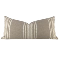 a beige and white striped pillow on a white background