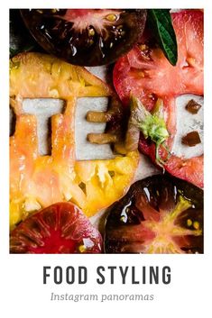 the word food styling spelled out in letters surrounded by sliced tomatoes and other fruits with leaves