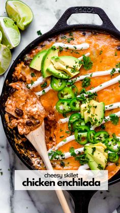 a skillet filled with mexican food and topped with avocado