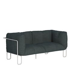 a gray couch sitting on top of a metal frame