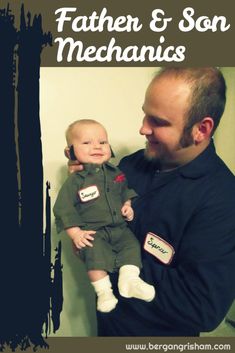 a man holding a baby in his arms with the words father and son mechanics on it