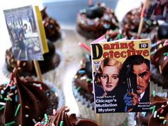 cupcakes decorated with chocolate frosting and sprinkles are on display