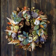 a wreath is hanging on a wooden door