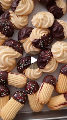 a tray filled with lots of cupcakes covered in frosting