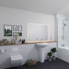 a bathroom with a sink, toilet and bathtub next to a shower head mounted on the wall