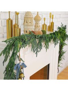 a fireplace mantel decorated with christmas decorations