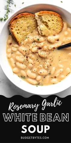 a white bean soup in a bowl with two pieces of bread on the side and text reading rosemary garlic white bean soup