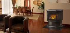 a living room filled with furniture and a fire place in the middle of a dining room