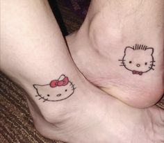 two people with hello kitty tattoos on their feet, one has a bow and the other has a cat