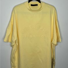 Fear Of God Essentials Heavy Jersey Crewneck T-Shirt Oversized Yellow Men’s Small. Nwt. Oversized Yellow T-shirt For Spring, Oversized Tops With Letter Print, Spring Streetwear Drop Shoulder Tops, Oversized Short Sleeve Top For Streetwear, Urban Drop Shoulder Tops For Spring, Urban Drop Shoulder Spring Tops, Urban Spring Drop Shoulder Tops, Spring Urban Drop Shoulder Tops, Oversized Yellow T-shirt With Letter Print