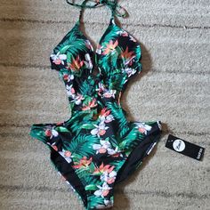 Boohoo Us Size 8 Swimsuit. Brand New With Tags, Still Has Protective Plastic Covering. Casual Floral Print Halter Neck Swimwear, Green One-piece Swimwear With Floral Print, Tropical Halter Neck Swimwear With Floral Print, Green Floral One-piece Swimwear, Green Floral Print One-piece Swimwear, Hawaiian Floral Print One-piece Swimwear, Green Halter Neck Swimwear With Floral Print, Green Floral Print Halter Neck Swimwear, Bohemian One-piece Floral Print Swimwear